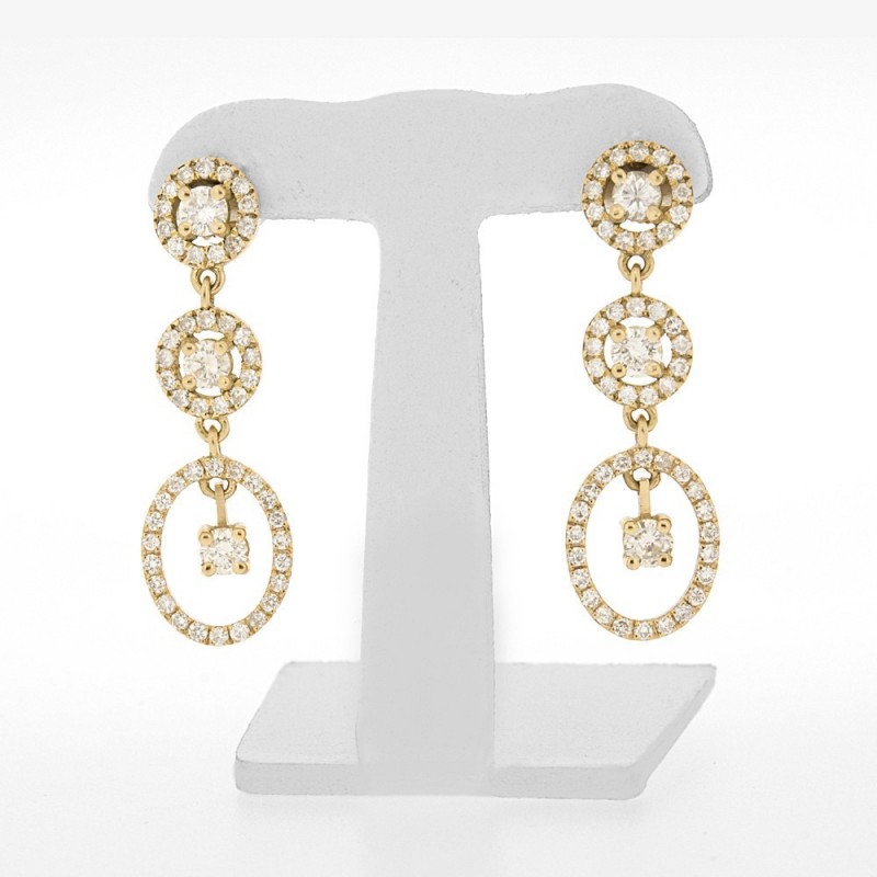 Boucles d'oreilles pendantes  pavées avec diamants de centre pampilles sertis griffes en or 18 carats