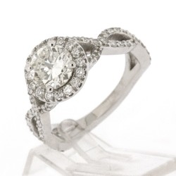 Solitaire or et diamants Caroline. torsade avec au centre un diamant rond et entourage diamants - or 18 carats